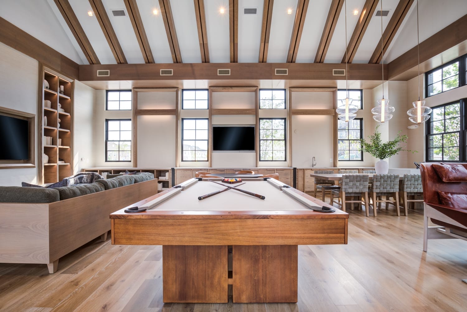 Clubroom with billiards, fireplace and entertainment kitchen at EDE Downtown Frederick, MD apartments