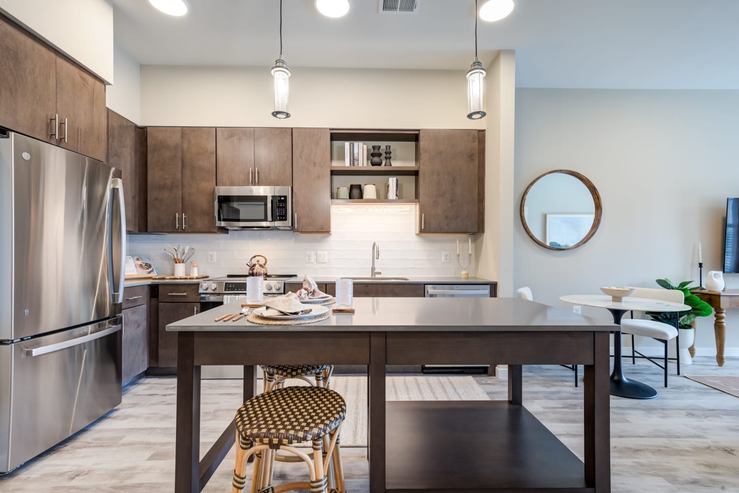 Select from two designer color schemes for cabinetry, countertops, and plank flooring finishes at EDE Downtown Frederick apartments